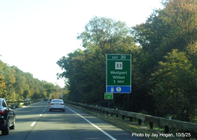 Image of the 1 Mile advance sign for the CT 33 exit, with new 
 milepost based exit number on CT 15 North/Merritt Parkway in Westport and Old Exit 41 sign on support, by Jay Hogan, October 2025