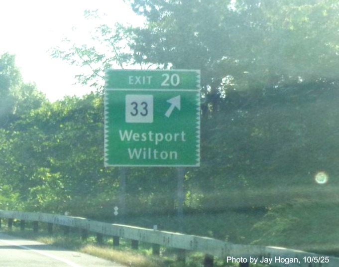 Image of the ground mounted exit sign for the CT 33 exit, with new 
 milepost based exit number on CT 15 North/Merritt Parkway in Westport, by Jay Hogan, October 2025