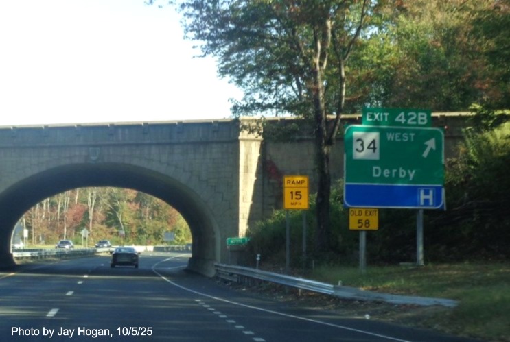 Image of ground mounted ramp sign for the CT 34 West exit, with new milepost 
 based exit numbers and yellow Old Exit 58 sign support on CT 15 North/Cross Parkway in Derby, by Jay Hogan, October 2025
