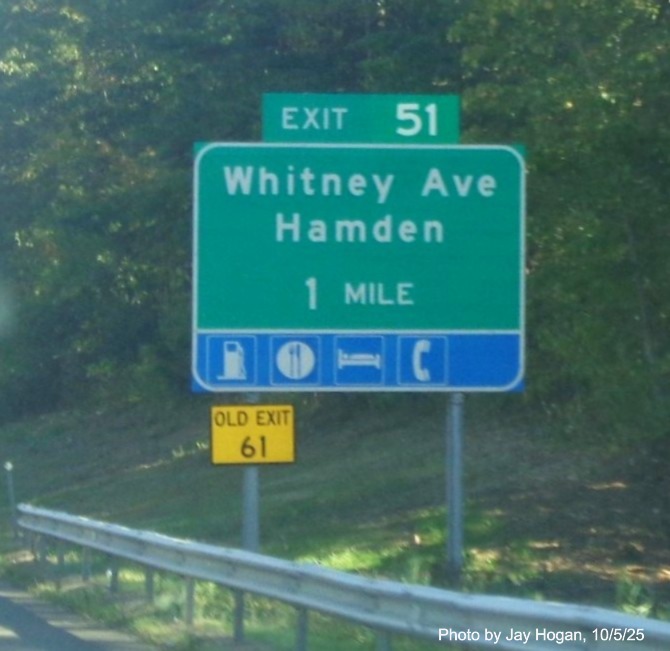 Image of ground mounted 1 Mile advance sign for the Whitney Avenue exit, with new milepost 
 based exit number and Old Exit 61 sign on support on CT 15 North/Cross Parkway in Hamden, by Jay Hogan, October 2025