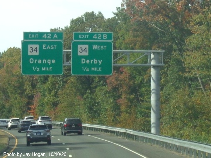 Image of mew 1/2 and 1/4 mile overhead advance signs for the CT 34 exit, placed in the fall
 of 2026 on CT 15 South/Cross Parkway in Derby, by Jay Hogan, October 2026
