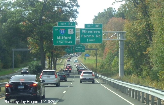 Image of new 1 1/4 miles advance overhead sign for the To I-95/US 1 exit, with new milepost 
 based exit number and Old Exit 53 sign on support post on CT 15 South/Cross Parkway in Milford, by Jay Hogan, August 2025