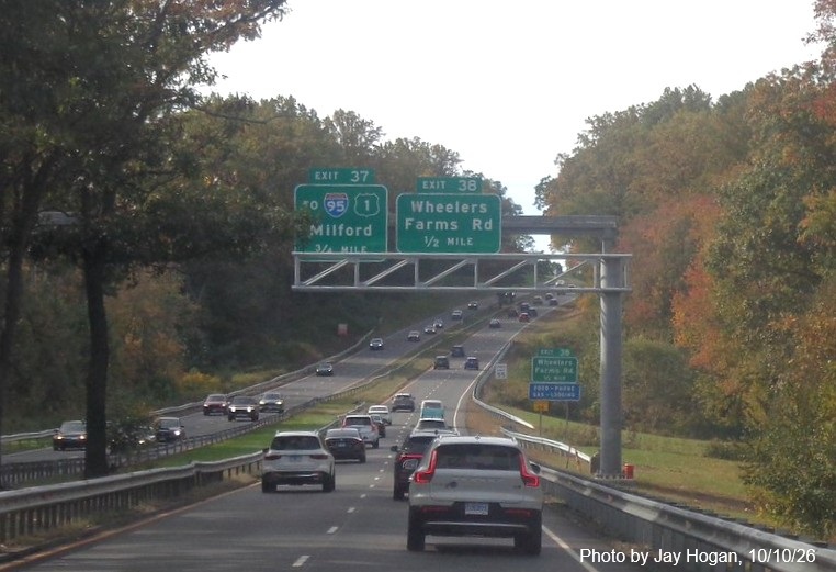Image of new overhead sign gantry awaiting sign for the To I-95/US 1 exit, with new milepost
 based exit number and Old Exit 53 sign on support post on CT 15 South/Cross Parkway in Milford, by Jay Hogan, August 2025