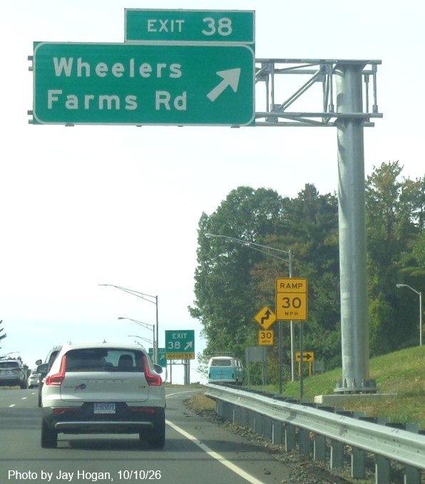 Image of new overhead ramp sign for the Wheelers Farms Road exit, with milepost 
 based exit number on CT 15 South/Cross Parkway in Milford, by Jay Hogan, October 2026