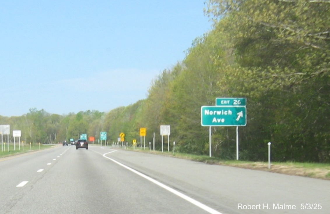 Image of ground mounted ramp sign for Norwich Avenue exit with new milepost based
exit number and on CT 2 West in Colchester, May 2025