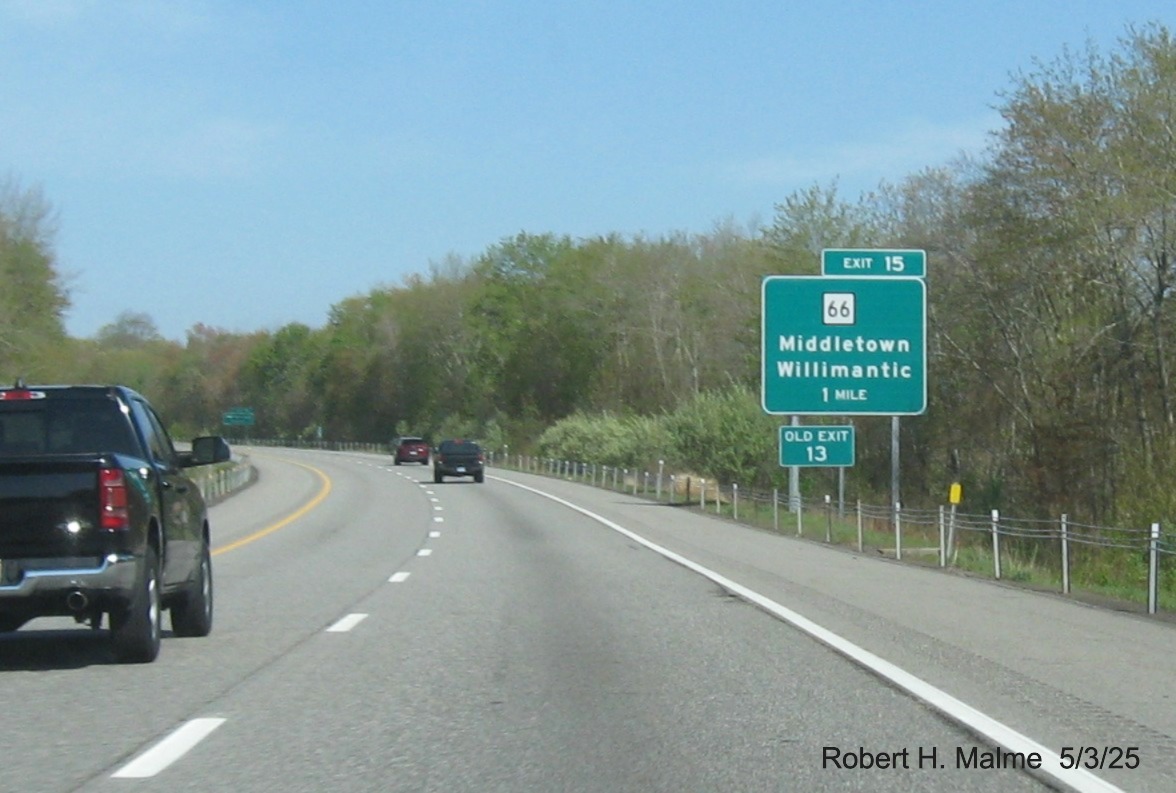 Image of ground mounted 1 mile advance sign for CT 66 exit with new milepost based
	  exit number and separate Old Exit 13 sign behind on CT 2 West in Marlborough, May 2025