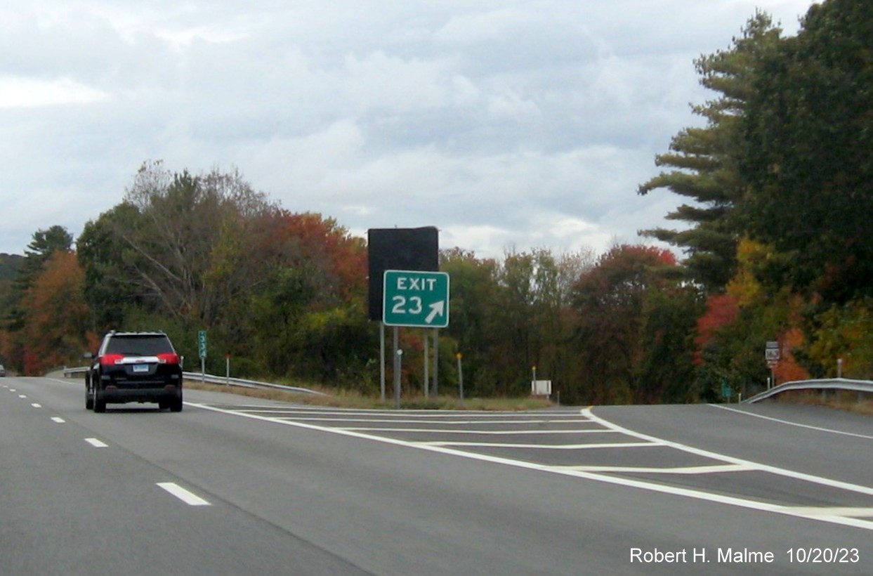 Image of old gore sign for CT 163 exit in front of new one on CT 2 West in Bazrah with covered 
      over future exit number and Old Exit 23 sign, October 2023