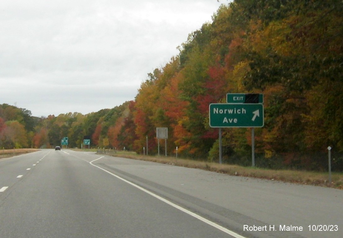 Image of new ground mounted ramp sign for Norwich Avenue exit on CT 2 West in Colchester with covered
over future exit number, October 2023