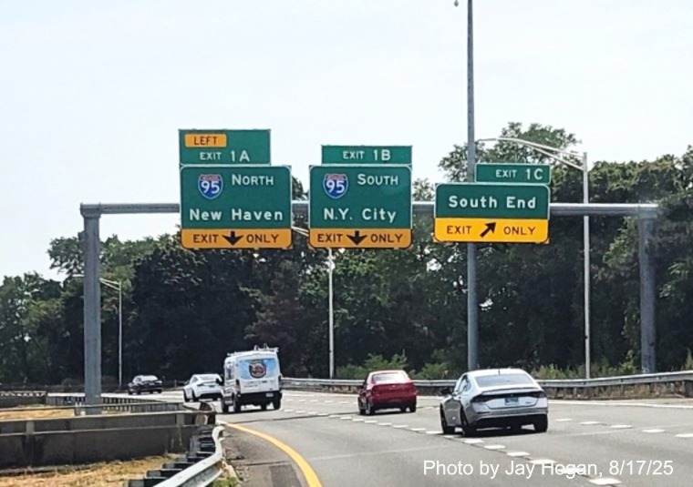 Image of overhead signage at ramp for South End exit with new milepost based exit 
	number tabs for I-95 exits on CT 8/25 South in Bridgeport, by Jay Hogan, August 2025,