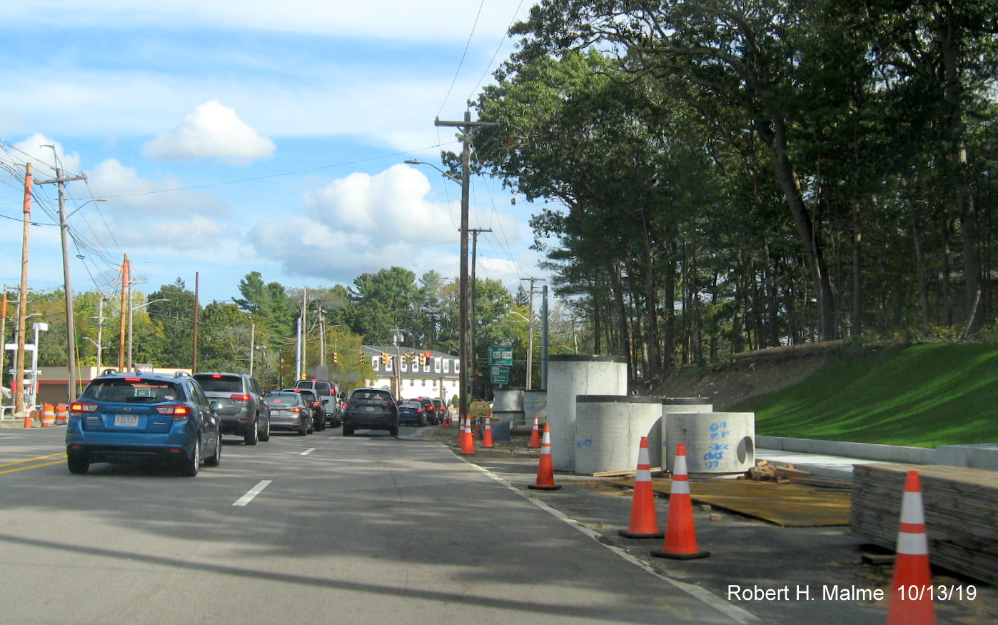 Image of drainage cisterns and culverts stored along the south side of Derby Street approaching intersection with MA 53 in Oct. 2019