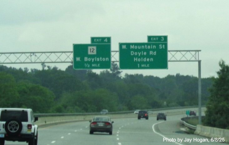 Image of new 1/2 Mile advance overhead for the MA 12 exit on I-190 South paired, on
	the wrong side, with the 1 Mile advance for the West Mountain Street exit in West Boylston, by Jay Hogan, June 2025