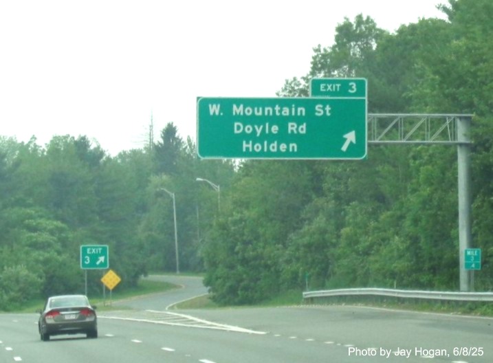 Image of new overhead ramp sign for the West Mountain Street exit on I-190 South 
		in Holden, by Jay Hogan, June 2025