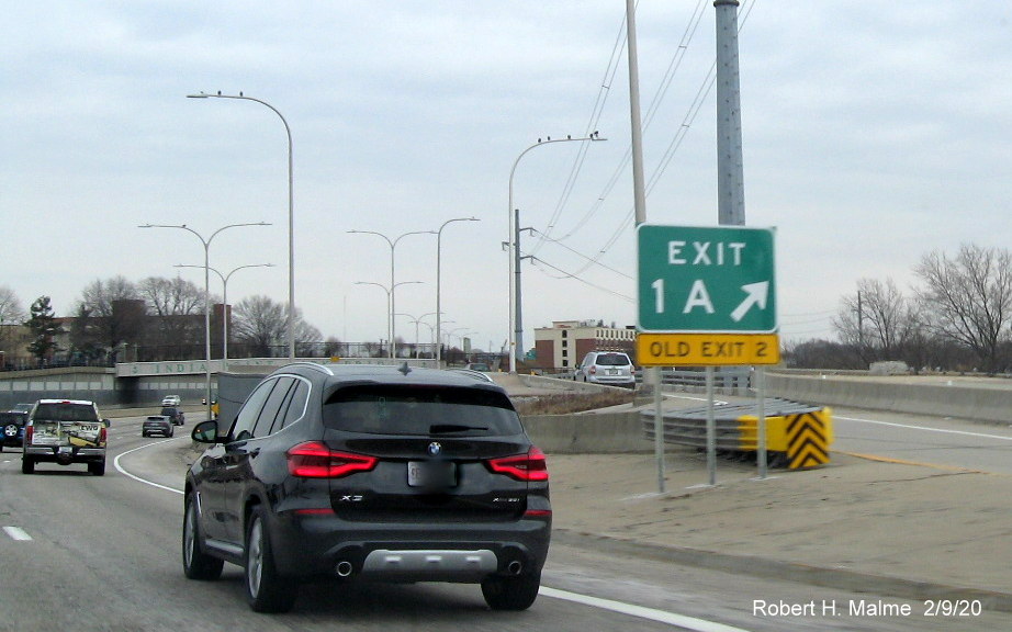 Image of new milepost based number gore sign for Gano Street exit and added yellow old exit number tab below on I-195 East in Providence