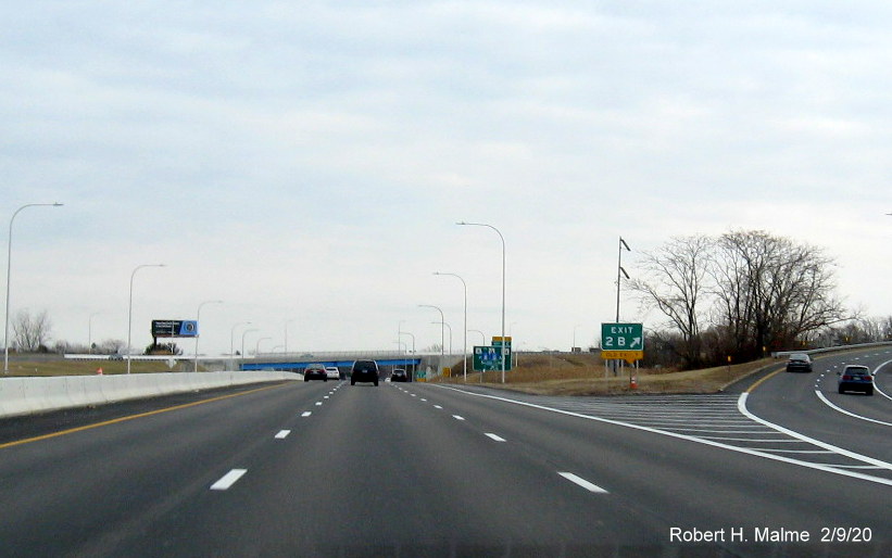 Image of new gore sign with milepost based exit number and yellow old exit tab below for RI 114 South exit on I-195 East in East Providence