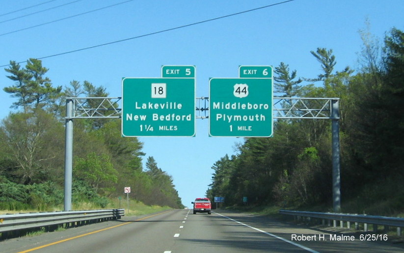 Image of recently placed advance overhead signs for MA 18 and US 44 exits on I-495 South in Middleboro in June 2016 MA 18