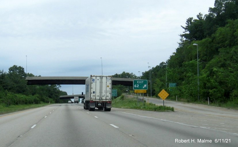 Image of gore sign for Simarano Drive exit with new milepost based exit number and yellow Old Exit 39C sign attached below on I-495 North in Southborough, June 2021
