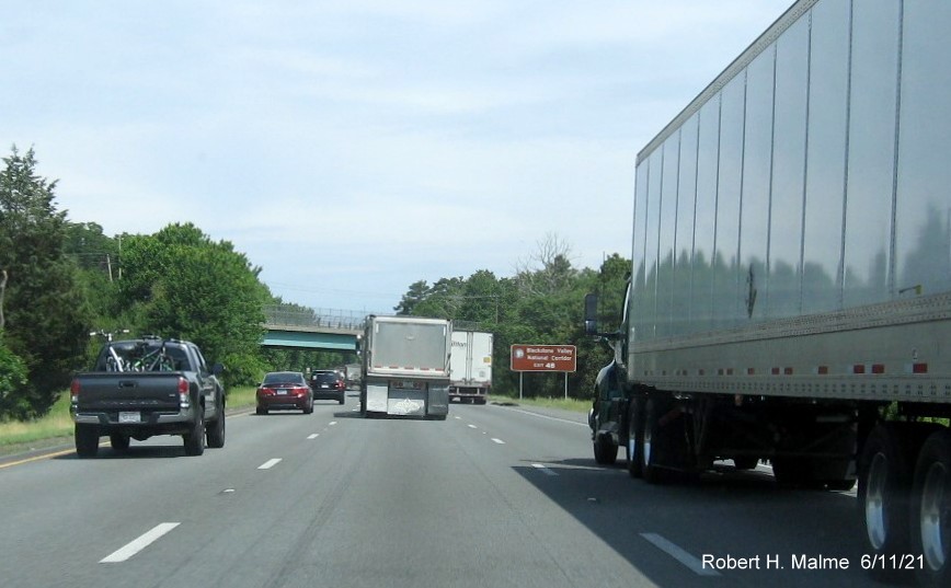 Image of brown auxiliary sign for MA 109 exit with new milepost based exit number on I-495 North in Milford, June 2021