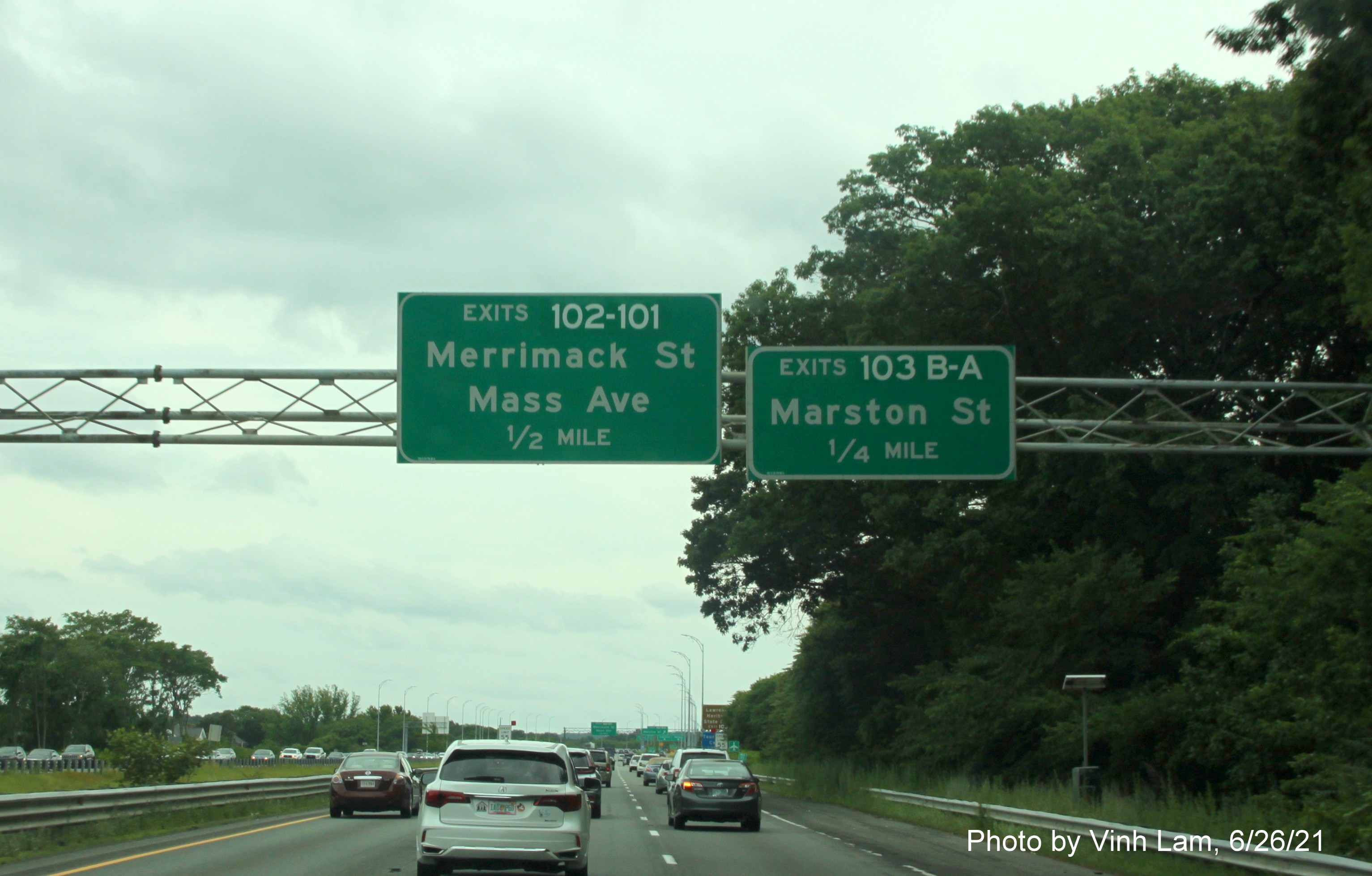 Image of advance overhead signs for /Mass Ave, and Marston Street exits with new milepost based exit numbers on 
                                             I-495 South in Lawrence, photo by Vinh Lam, June 2021