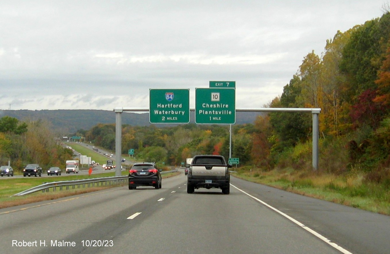 Image of new overhead signs for the I-84 and CT 10 exits with new milepost based exit number 
         on I-691 West in Cheshire, October 2023