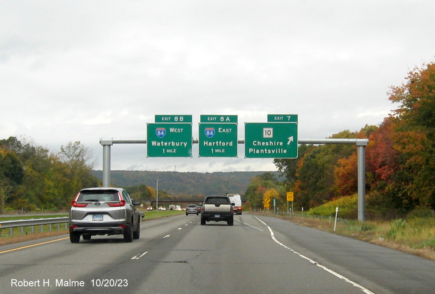 Image of new overhead signs at the CT 10 exit with new milepost based exit number 
         on I-691 West in Cheshire, October 2023