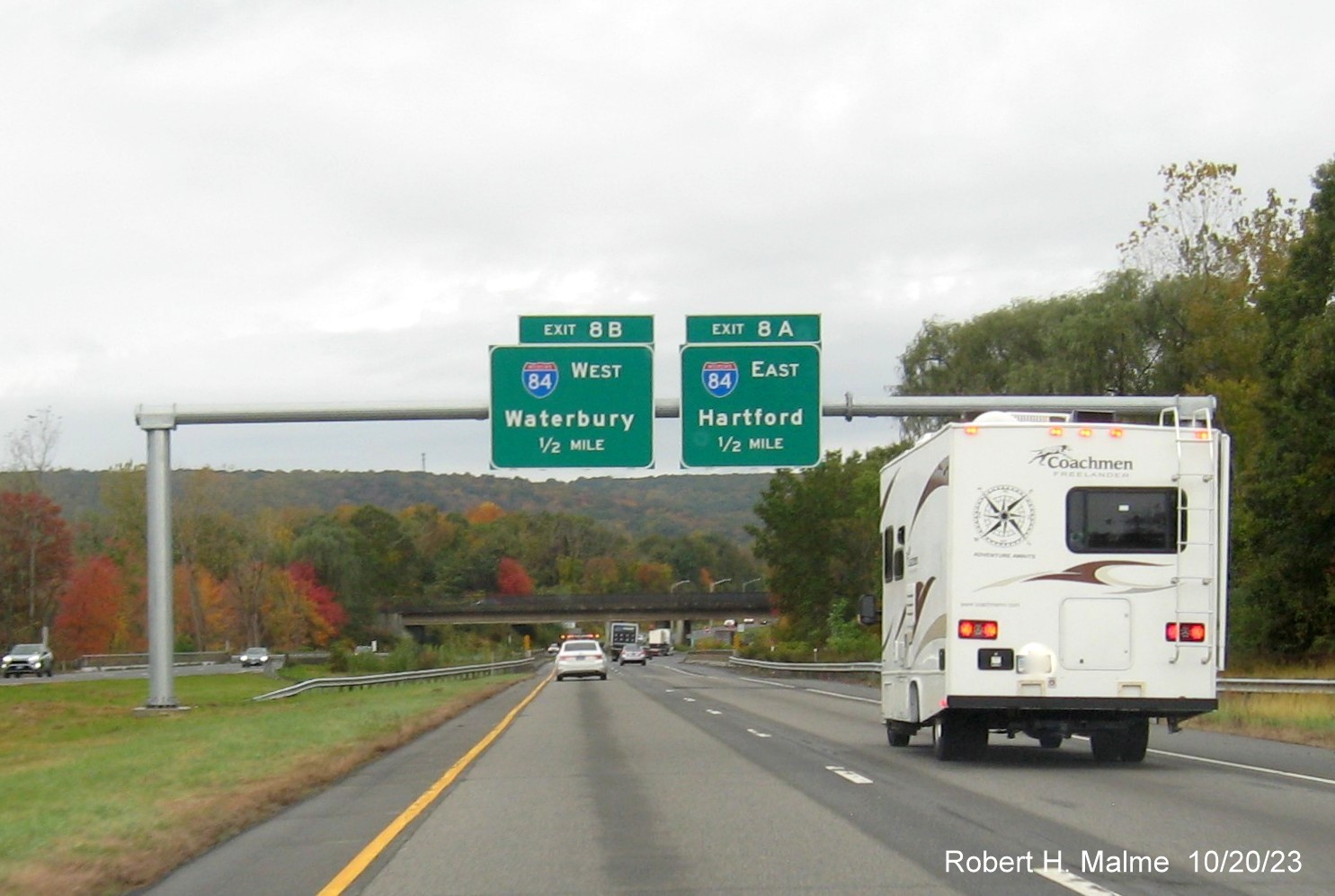 Image of new overhead signs for the I-84 exits with new milepost based exit number 
         on I-691 West in Cheshire, October 2023