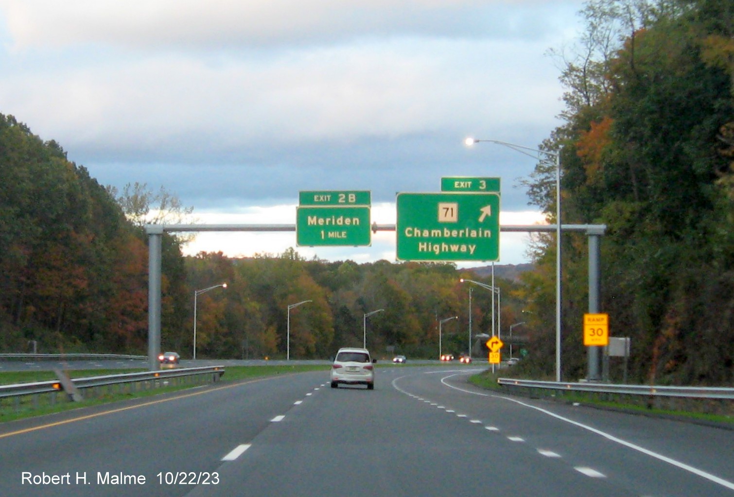 Image of new one mile advance sign for the Merdien exit with exit sign for NC 71 with the new milepost 
      based exit numbers, October 2023