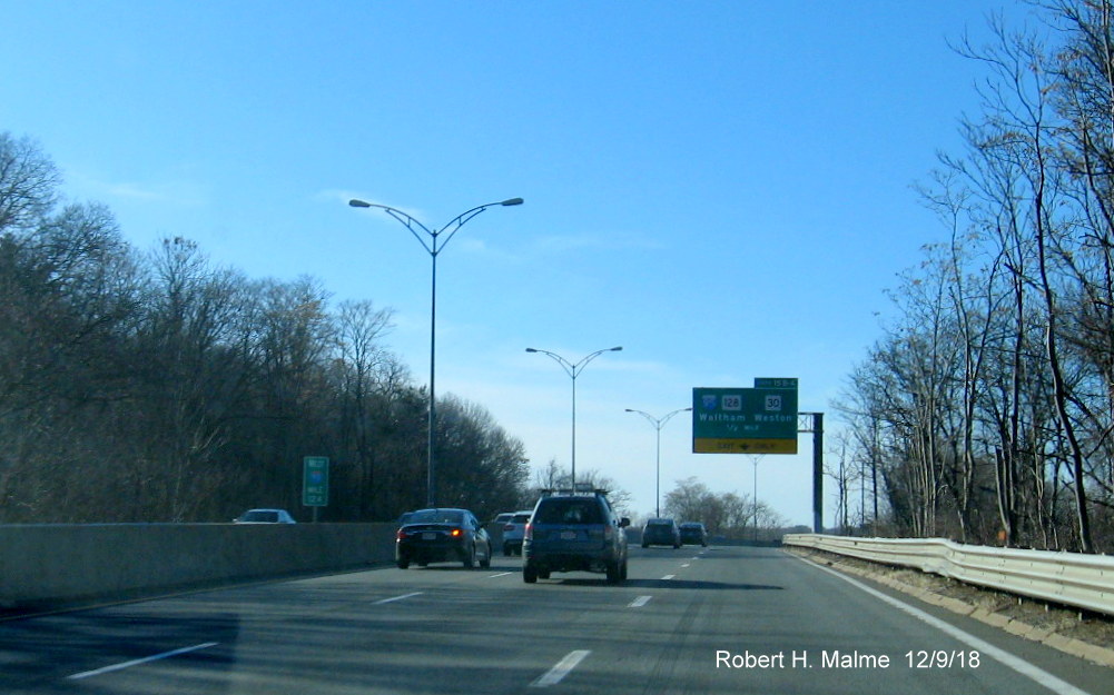 Image of new 124 milemarker on I-90 West in Weston in front of existing advance sign for I-95 exit