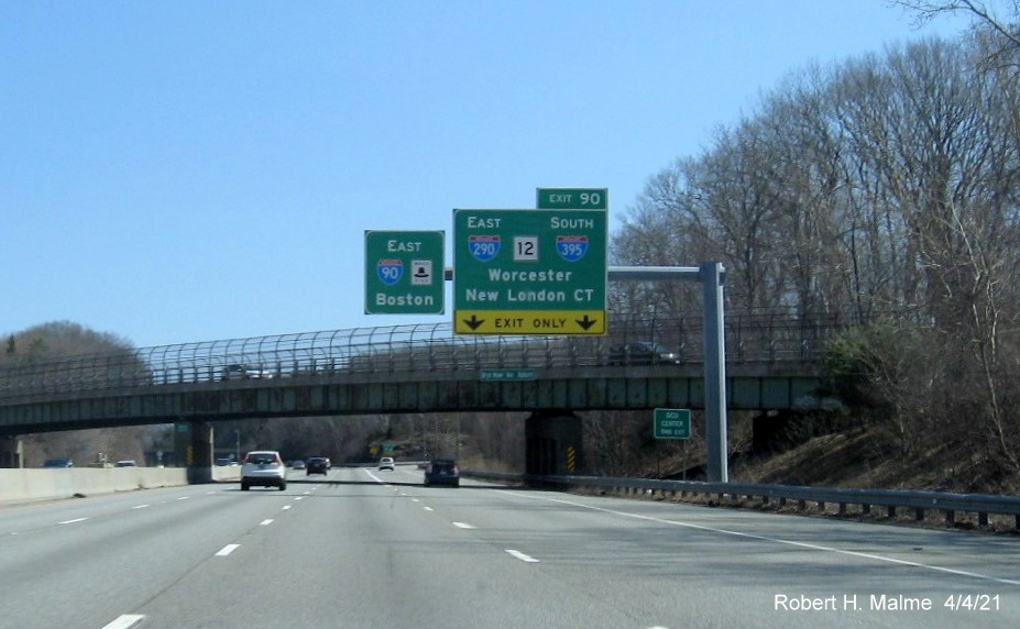 Image of overhead ramp sign for I-290/I-395/MA 12 exit with new milepost based exit number 
                                             on I-90/Mass Pike East in Auburn, April 2021