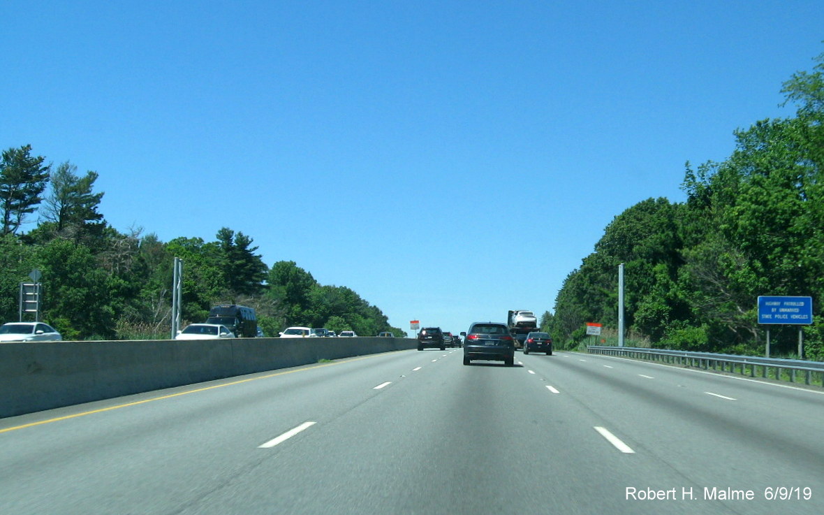 Image of recently placed support posts for future 1-mile advance overhead sign for I-95 exit on I-90/Mass Pike West in Weston in June 2019