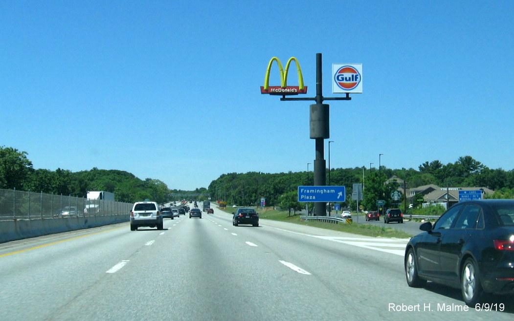 Image of newly placed mixed case blue gore sign for Framingham Service Plaza on I-90/Mass Pike West