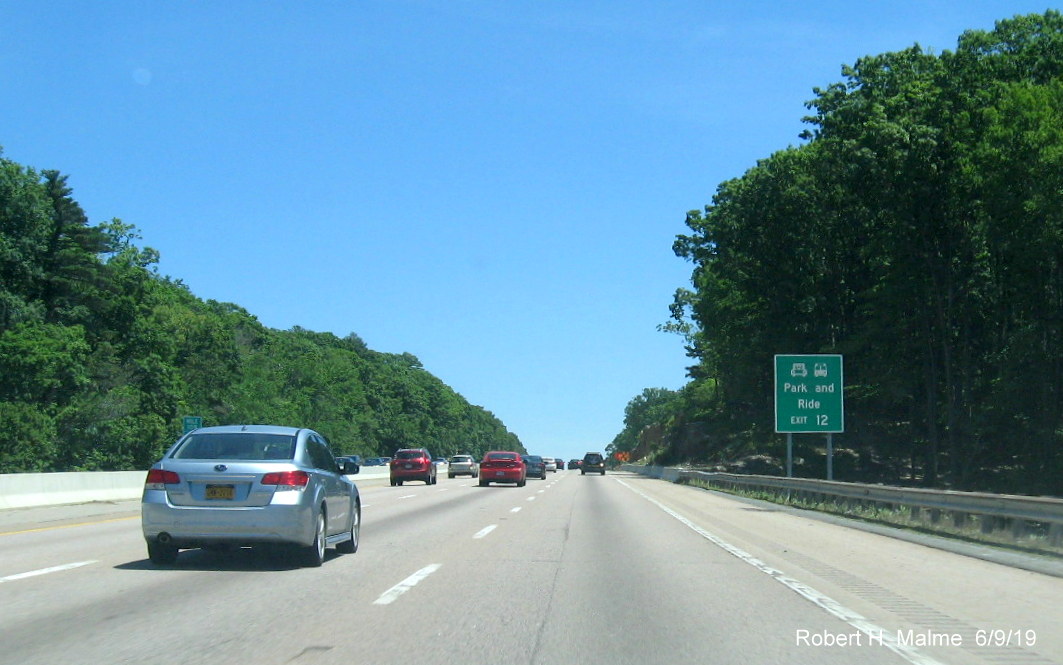 Image of new auxiliary sign for park and ride services prior to MA 9 exit on I-90/Mass Pike East in Framingham