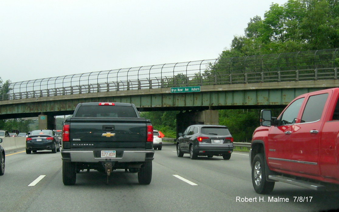 Image of new street and town identification sign above I-90/Mass Pike West in Auburn