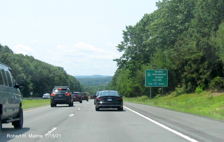 Image of auxiliary sign for I-91/US 5 exit with new milepost based exit number on I-90/Mass Pike West in Springfield, July 2021