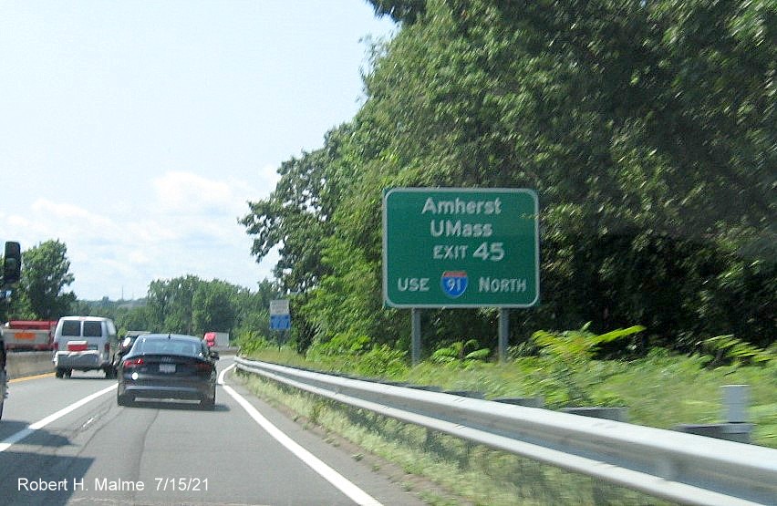 Image of auxiliary sign for I-91/US 5 exit with new milepost based exit number on I-90/Mass Pike West in Springfield, July 2021