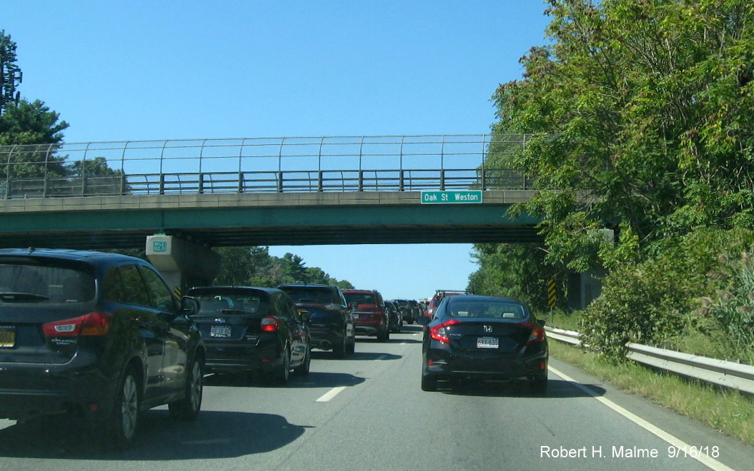 Image of new bridge sign identifying street and town on I-90/Mass Pike West in Weston