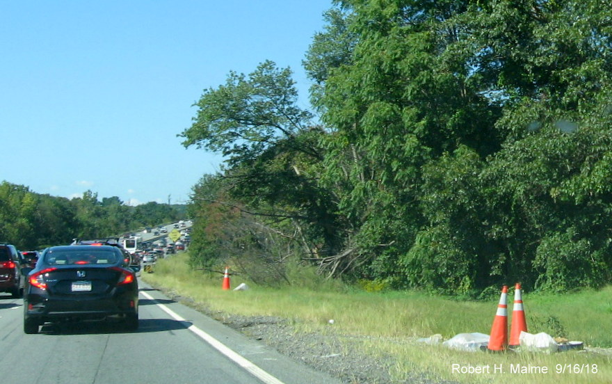 Image of sign foundations placed by shoulder of I-90/Mass Pike West in Weston