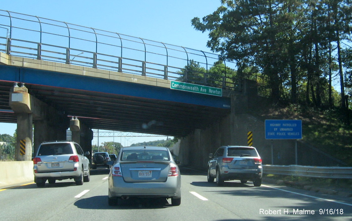 Image of newly placed street and city name sign on Commonwealth Ave bridge over I-90/Mass Pike East in Newton
