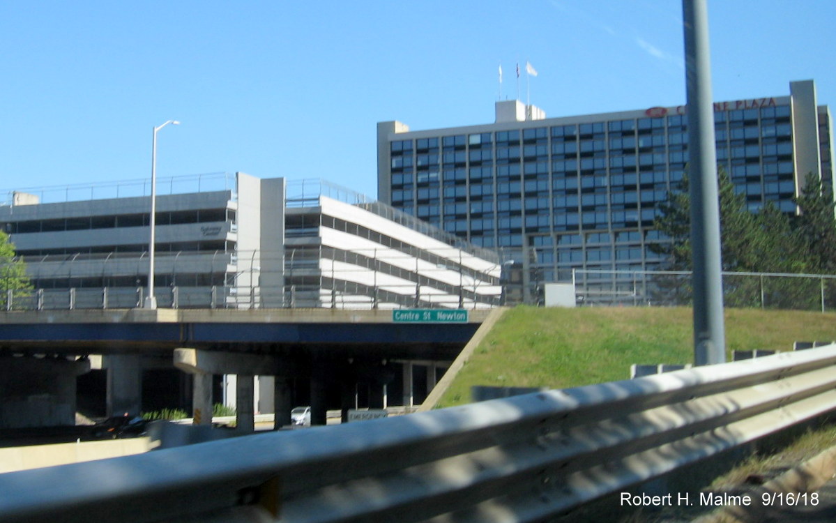 Image of new street and city name sign over I-90/Mass Pike East on Centre Street bridge in Newton
