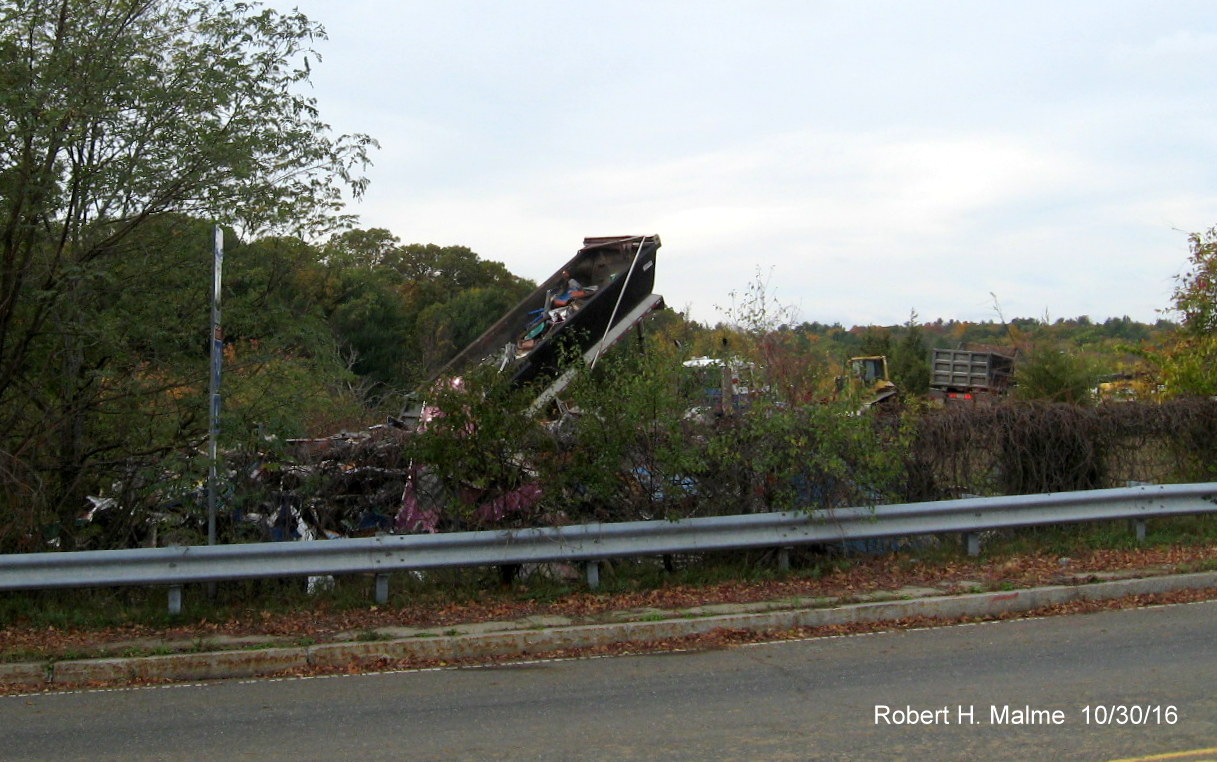 Image of tool booth debris being dumped across from exit ramp to MA 30 from I-90 West in Weston
