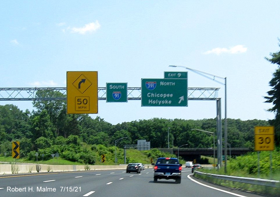 Image of overhead ramp sign for I-391 North exit with new milepost based exit number on I-91 South in 
                                         West Springfield, July 2021
