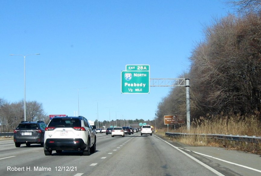 Image of 1/2 mile advance overhead sign for I-95/128 North exit with new milepost based exit number 
                                          on I-93 North in Woburn, December 2021