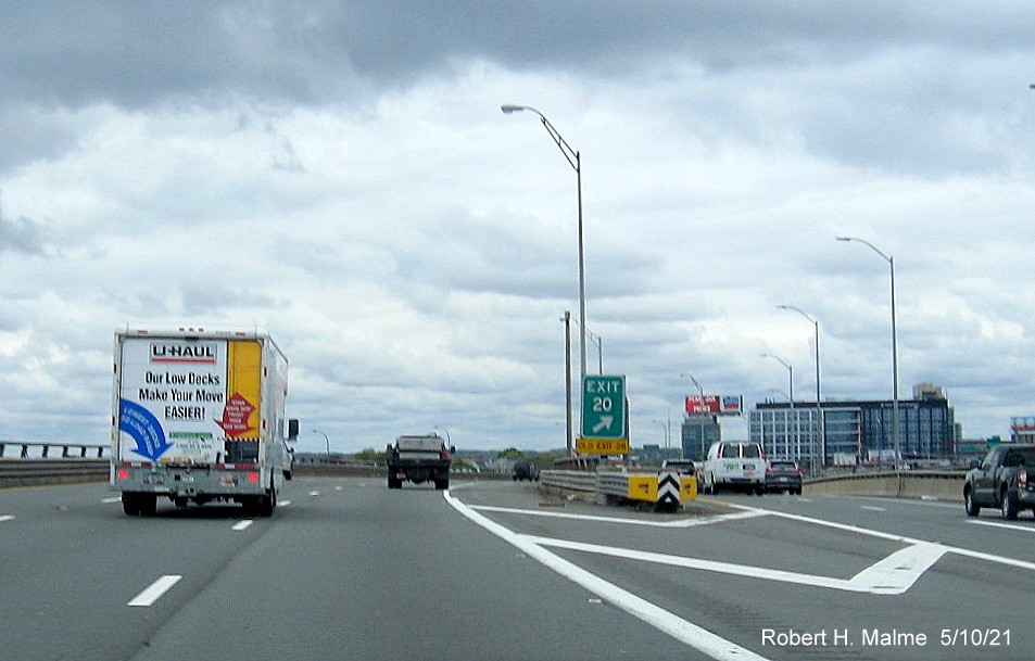 Image of gore sign for To MA 99 exit with new milepost based exit number on I-93 North in Charlestown, May 2021