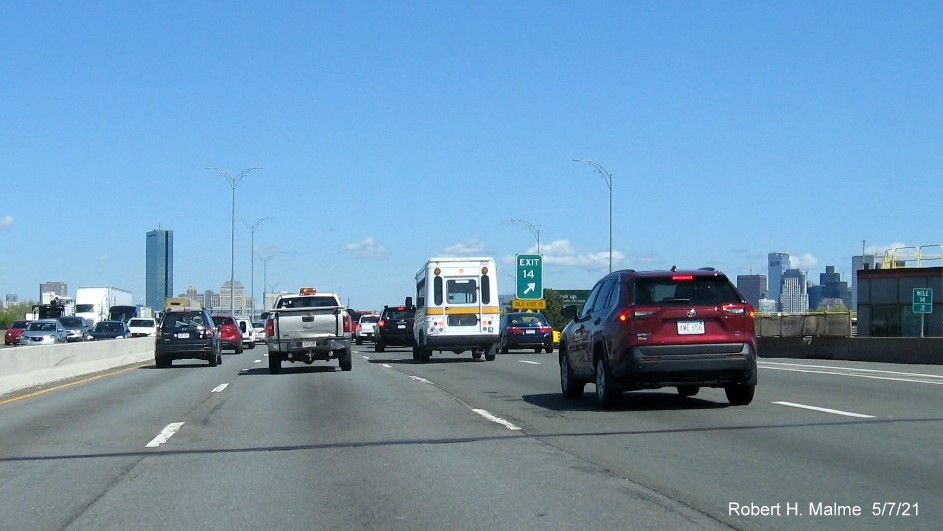 Image of thin gore sign for Columbia Road exit with new milepost based exit number and yellow Old Exit 15 sign attached below on I-93/Southeast Expressway North in Dorchester, May 2021