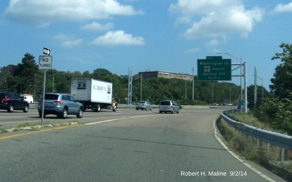 Image of newly placed support poles for future overhead signage near Exit 7 on I-93 North in Braintree