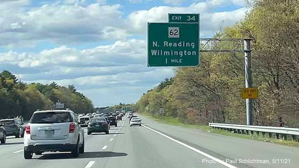 Image of 1 mile advance sign for MA 62 exit with new milepost based exit number and yellow
                                           Old Exit 40 advisory sign on support on I-93 North in Wilmington, by Paul Schlichtman, May 2021