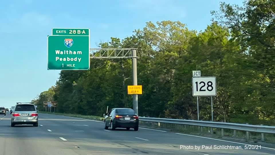 Image of 1 mile advance overhead sign for I-95/MA 128 exits with new milepost based exit numbers and 
                                            yellow Old Exits 37 B-A advisory sign on support on I-93 South in Woburn, by Paul Schlichtman, May 2021