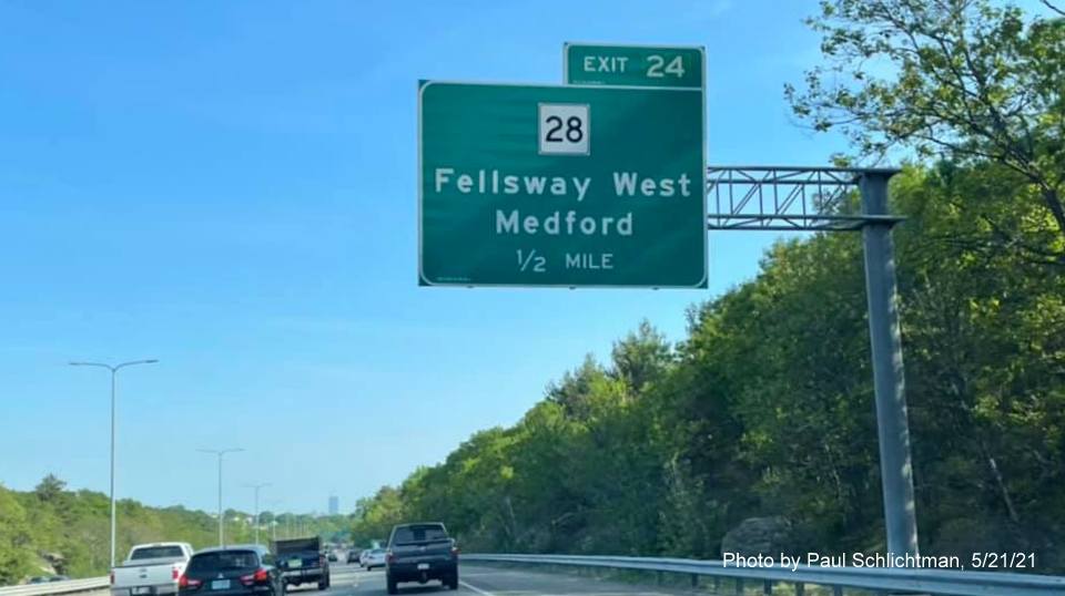 Image of 1/2 mile advance overhead sign for MA 28 Fellsway West exit with new milepost based exit number on I-93 South 
                                            in Medford, May 2021