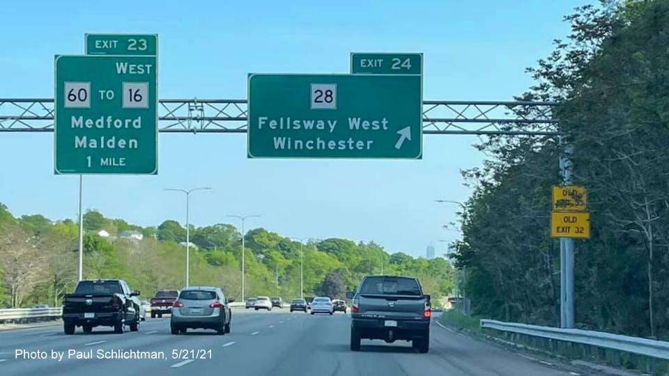 Image of overhead ramp sign for MA 28 Fellsway West exit with new milepost based exit number on I-93 South 
                                            in Medford, May 2021