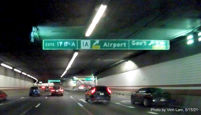 Image of overhead tunnel ceiling mounted ramp sign for MA 1A/Government Center exits with new milepost based exit numbers on I-93 South in Boston, by Vinh Lam, May 2021