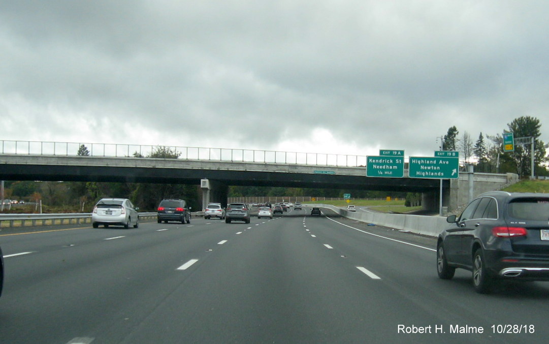 Image of traffic using all four lanes heading under Highland Ave bridge on I-95 South in completed Add-A-Lane Project work zone in Needham